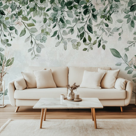 Botanical leaf wallpaper mural in modern living room creating a fresh, natural atmosphere