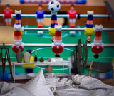 Table soccer design wallpaper in office break room with lounge seating