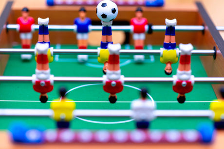 Football game table design file showing detailed pattern of red and blue players on green field