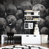 Black and white football wallpaper adding style to a kids playroom setting