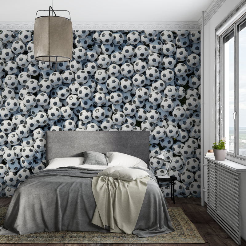 Black and white football wallpaper transforming kids playroom into sports zone