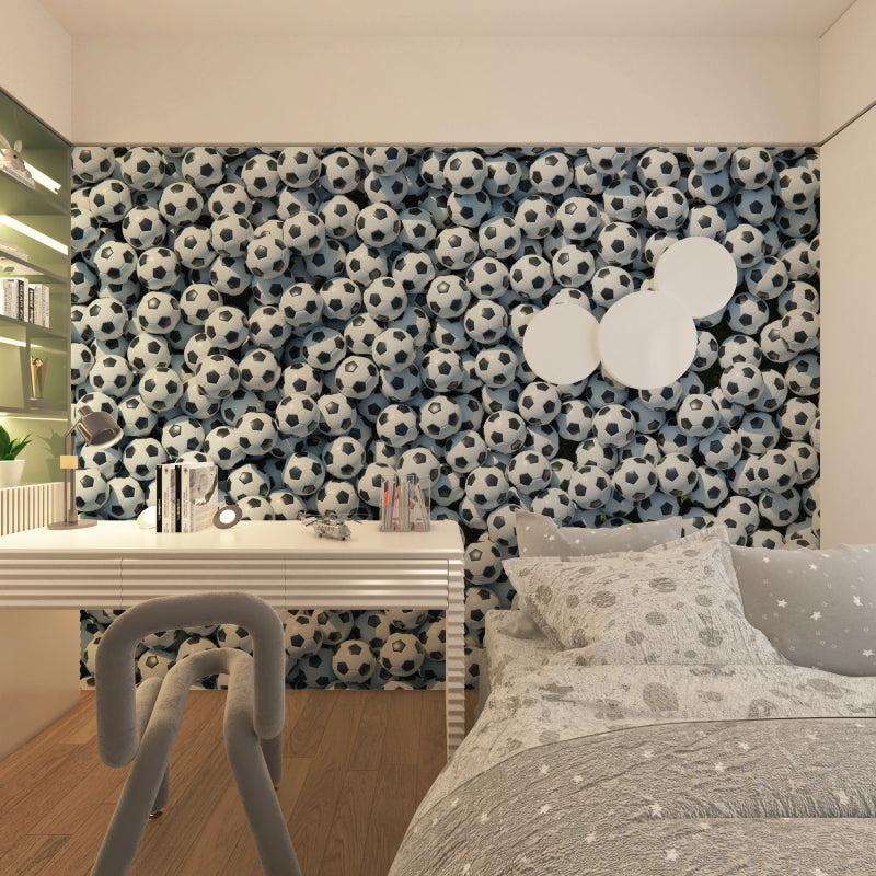 Football themed wallpaper adding character to modern game room setup