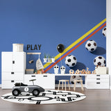 Kids room with soccer wallpaper creating energetic atmosphere