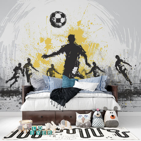 Football wall mural in modern teen bedroom showing dynamic black and gold design with player silhouettes