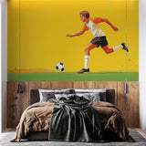 Football wall mural bringing sporty energy to a modern teen bedroom, showing dynamic player design against yellow background