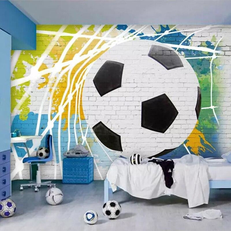 Football wall mural in modern teenage bedroom showing dynamic soccer ball design