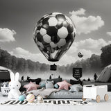 Black and white football mural displayed in spacious living room with minimal furniture