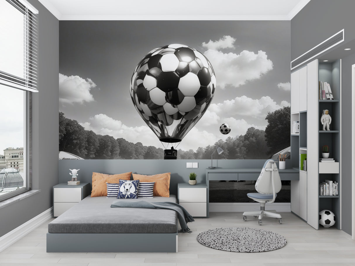 Sports themed wall mural in game room showing scale of football balloon design