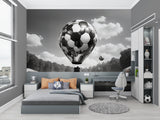 Sports themed wall mural in game room showing scale of football balloon design
