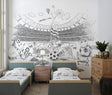 Football stadium wallpaper creating a dramatic focal point in a modern living room with black and white furniture