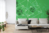 Football strategy wallpaper displayed in modern game room, showing tactical formations on green background