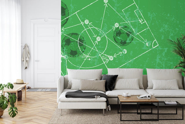 Football strategy wallpaper displayed in modern game room, showing tactical formations on green background