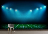 Football stadium wallpaper mural creating depth in a modern game room with dramatic night lighting effects