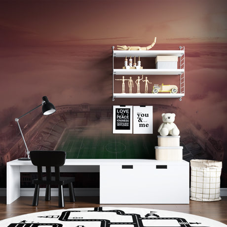 Football stadium wallpaper mural bringing energy to a modern living room with sunset sky backdrop