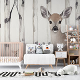 Forest animal wallpaper with baby deer and birch trees creating a cozy atmosphere in a modern nursery