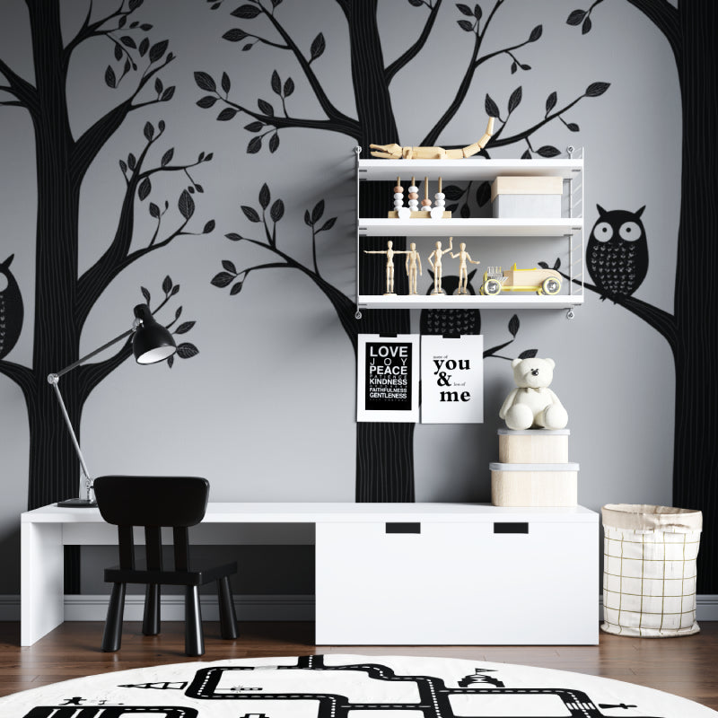 Black and white forest animals wallpaper creating a cozy atmosphere in a modern nursery