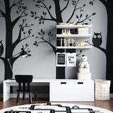 Black and white forest animals wallpaper creating a cozy atmosphere in a modern nursery
