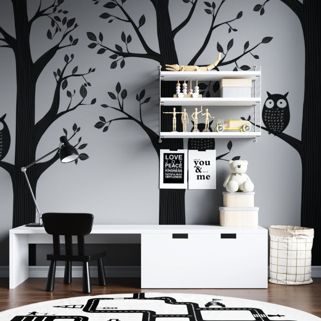 Black and white forest animals wallpaper creating a cozy atmosphere in a modern nursery