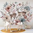 Forest animals wallpaper in bright nursery with white furniture, showing deer and pastel florals