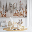 Forest animals wallpaper in a bright nursery with white furniture, showing deer and woodland creatures