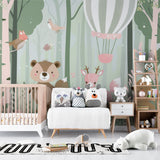 Woodland nursery wallpaper displayed in a reading nook with soft furnishings