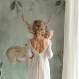 Deer wallpaper bringing nature inside bedroom with morning light
