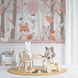 Forest Animals Wallpaper in a soft pink nursery with rocking chair and white furniture
