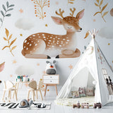 Forest animal wallpaper creating a cozy atmosphere in a white nursery with natural wood furniture