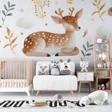Woodland nursery wallpaper with sleeping fawn in a modern kids bedroom with minimalist decor