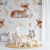 Deer nursery wallpaper showcased in a reading nook with soft lighting and cushions