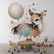 Forest animal wallpaper with watercolor deer and balloon styled in a cozy nursery with natural wood furniture and soft textiles