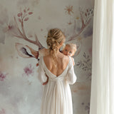 Whimsical animals wallpaper in baby nursery with crib and mobile