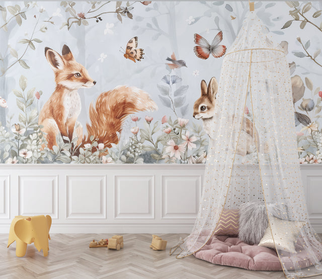 Woodland animals wallpaper creating a cozy atmosphere in a modern nursery with white furniture