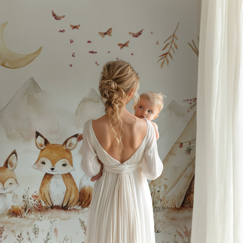 Woodland theme nursery with fox mural wallpaper and matching decor elements