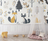 Forest animals wallpaper creating a cozy atmosphere in a modern nursery with yellow and grey accents