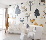 Forest animals mural bringing whimsy to a toddler's bedroom with gentle colors