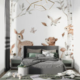 Woodland creatures wallpaper creating a cozy reading nook in a children's bedroom