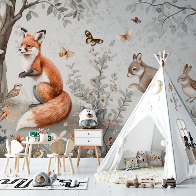 Forest animals wallpaper in a bright modern nursery with white furniture and natural decor