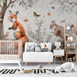 Woodland nursery wallpaper creating a cozy reading nook with rocking chair