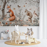 Forest animals mural styled in a gender-neutral nursery with minimal decor