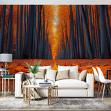 Forest path wallpaper mural creating depth in a modern living room, golden autumn colors warm up the space