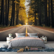 Forest wallpaper mural in modern living room showing golden autumn trees and path creating depth