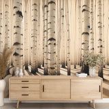 Birch forest wallpaper in sepia tones creating a cozy atmosphere in a modern living room with natural light