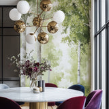 Birch forest wallpaper creating a calm atmosphere in a modern living room with natural light