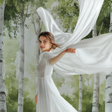Woodland tree mural transforming a bedroom into a peaceful forest retreat