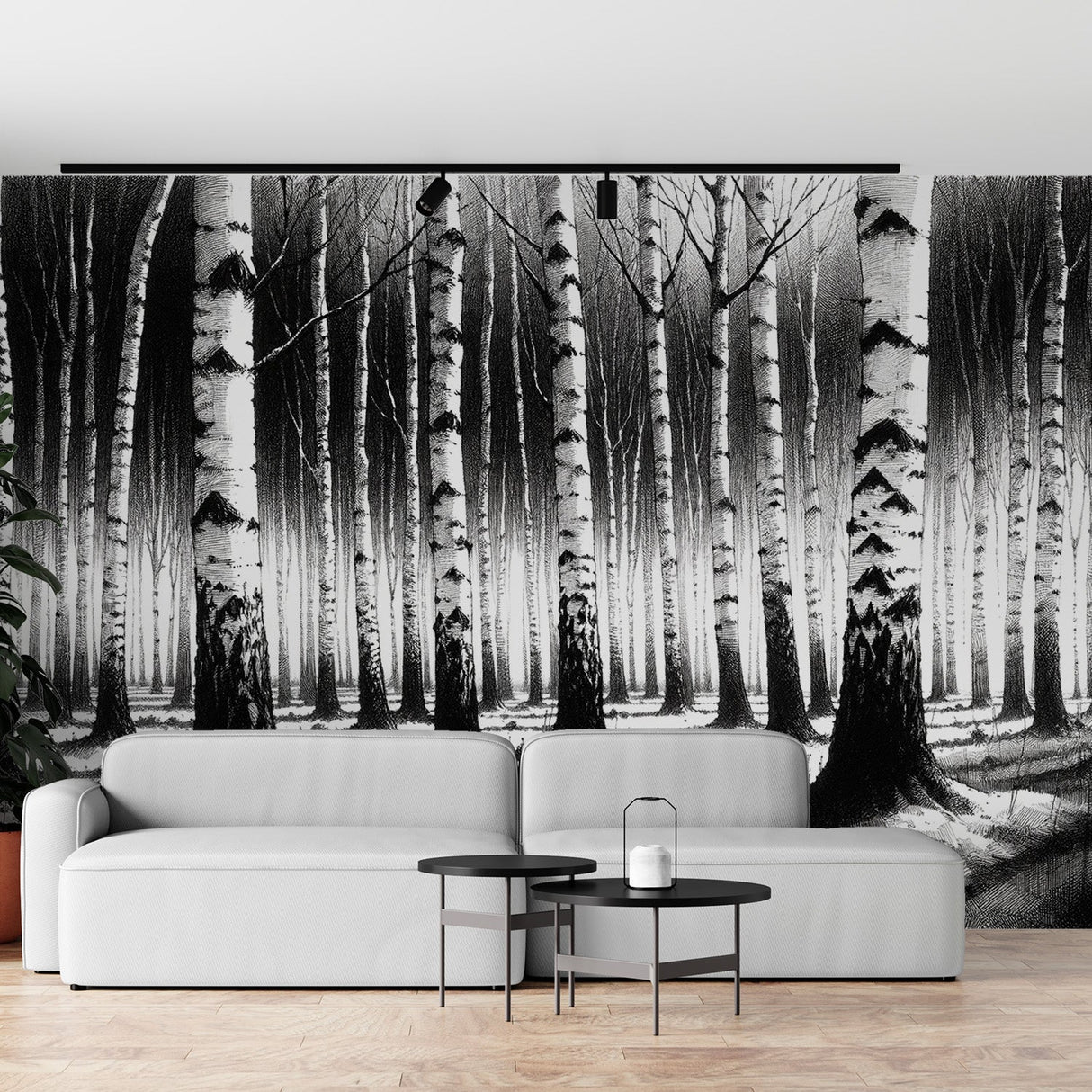 Black and white forest wallpaper creating depth in a modern living room with minimal furniture and natural light
