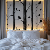 Black and white forest wallpaper making a statement in home office