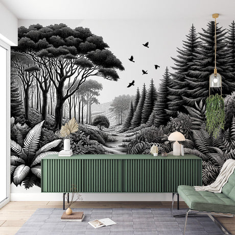 Black and white forest wallpaper creating depth in a minimal Scandinavian living room with natural light