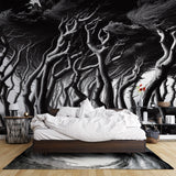 Black and white forest wallpaper creating depth in a modern living room with minimalist furniture