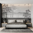 Black and white forest wallpaper in modern living room with gray sofa
